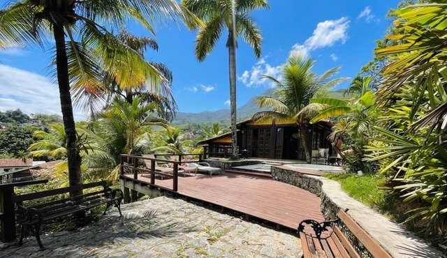 Beachfront house with sea and mountain views
