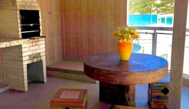Beautiful beach in Praia dos Anjos with private barbecue, air conditioning, cable TV, WiFi, and beach view.
