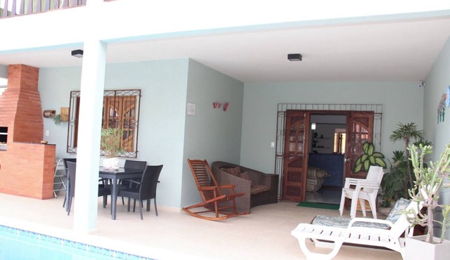 Beautiful mansion with pool, barbecue area, garage, master suite, and hot tub.