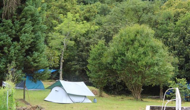 Camping area with waterfall and small beach in the Serra da Mantiqueira in Munhoz-MG