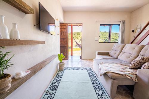 Casa a 900m da Praia, com Churrasqueira, Varanda com Rede e Terreno grande