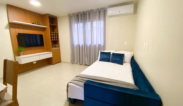 Casa com churrasqueira Ar e 2 quartos