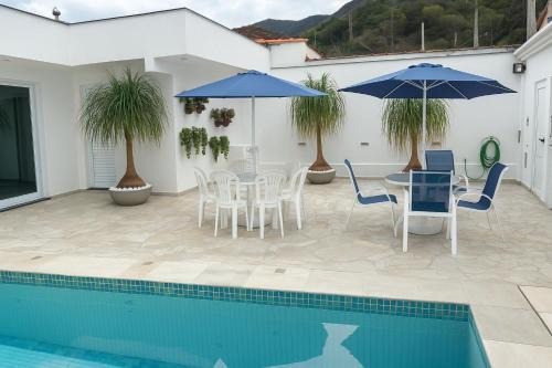 Casa Espaçosa com 5 Quartos Piscina Privativa 300m da Praia Ar condicionado em todos cômodos