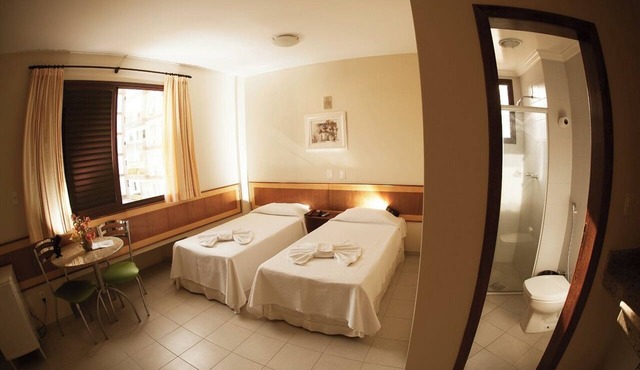 Centrally Positioned Room Ideal for Exploring Caratinga Attractions |Onsite Pool in Minas Gerais