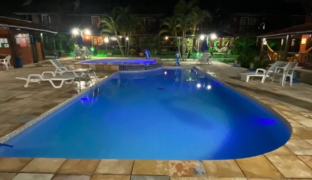 Chalet with heated pool and children's playground.
