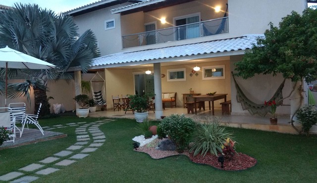 Comfortable 4-suite house in a great gated community with lots of greenery, beach and river.