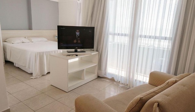 Confortável suíte integrada com vista mar em Natal por Carpediem