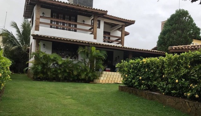 Cozy and charming house with pool and gardens in a beachfront condominium!