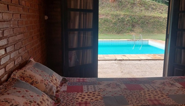 Cozy suite with relaxing pool view surrounded by nature