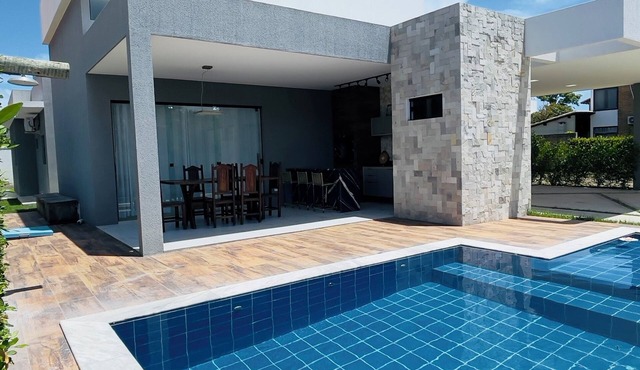 Exclusive paradise, House in a beachfront condominium.