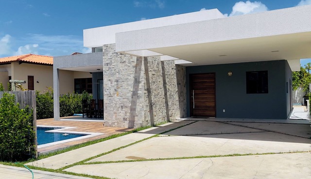 Exclusive paradise, House in a beachfront condominium.
