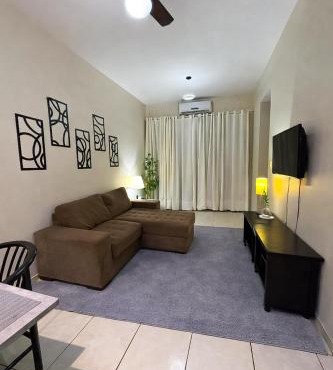 Flat central com estacionamento