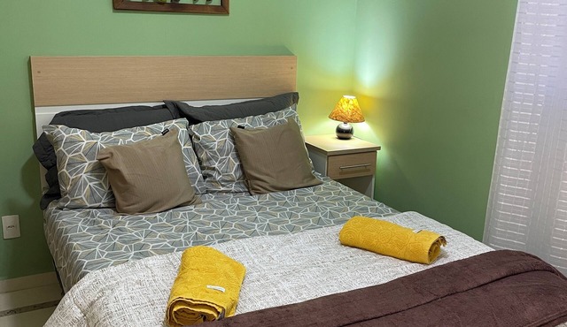 Green apartment in the center of Caxambu.