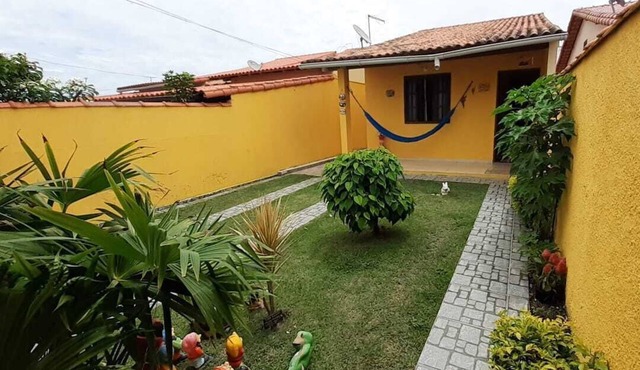 House with barbecue and beach at the end of the street
