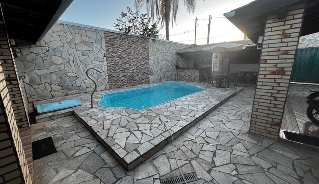 House with pool and barbecue.