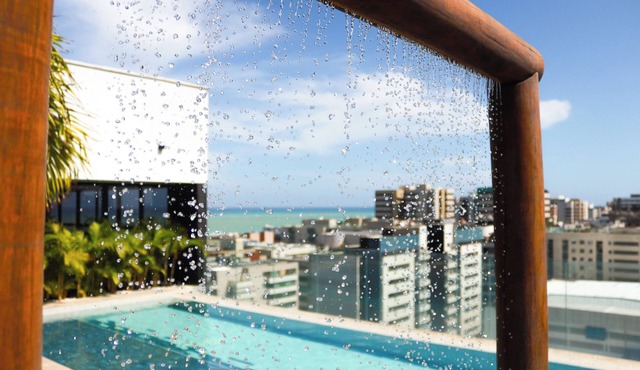 Modern studio apartment in Maceió with ocean view, gym, and parking, 200 meters from the beach.