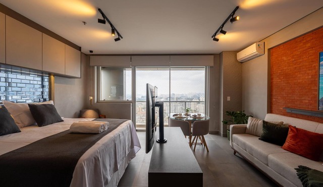 Modern studio apartment with queen-size bed in Cityplex Osasco.