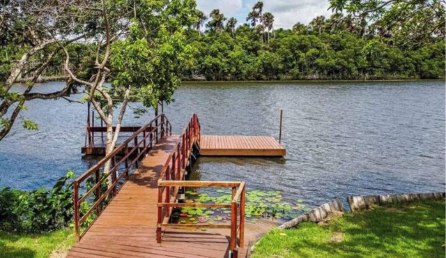 Riverfront with pier and pool