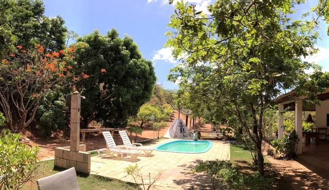 Site with typical country house, woods, swimming pool, barbecue and wood stove