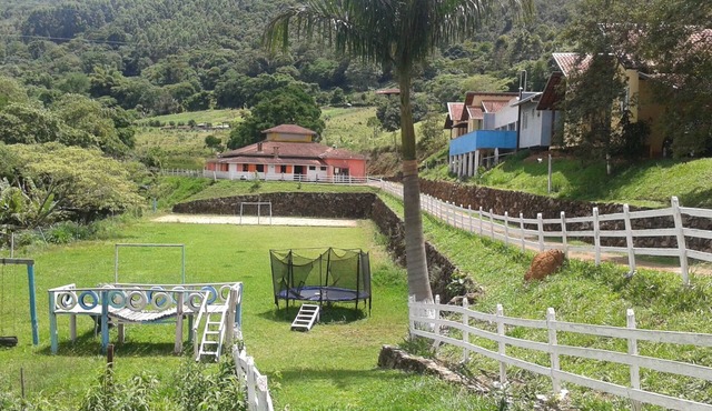 Solarium Farm with 19 bedrooms, party hall, field, swimming pool, all paved access.
