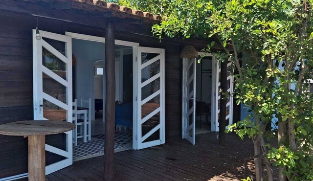 Stylish cabin with large deck overlooking Costa and Tiririca beaches.
