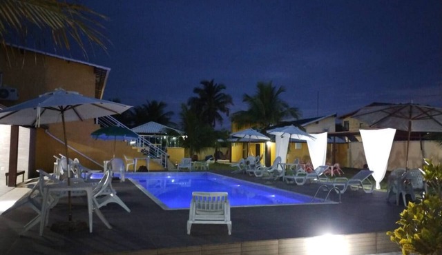 Suite with private balcony, hammock, air conditioning, minibar and queen-size bed.