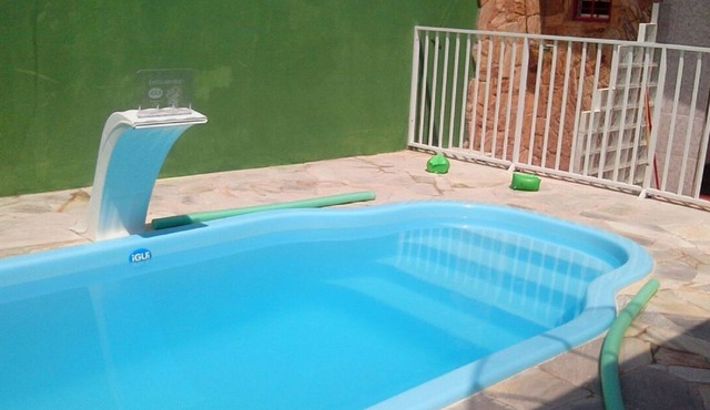 Vacation home with pool, fan, barbecue, Wi-Fi, and air conditioning.