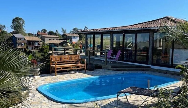Villa Santorini Praia do Rosa with pool and jacuzzi.